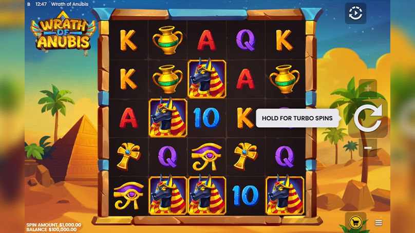 Wrath of Anubis slot graphics showing an Egyptian grid with high-value symbols against a backdrop of desert pyramids.